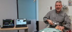 Dr. Scot Mountain with the patient simulator at Kootenay Boundary Regional Hospital.